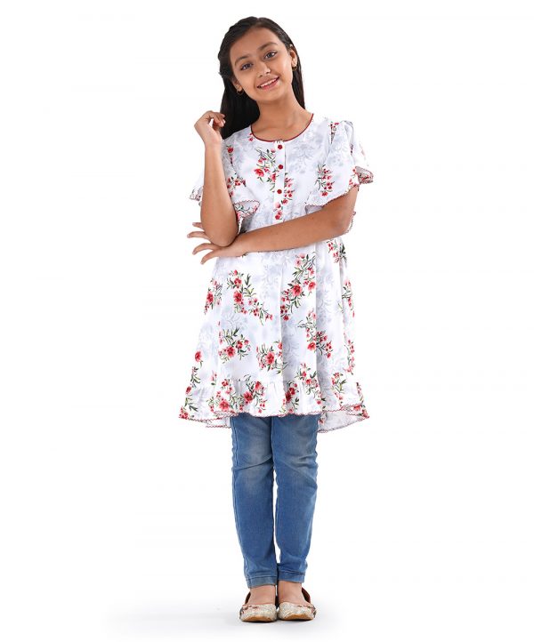 White Georgette A-line Tunic in printed Georgette fabric. Features a round neck with button opening at the front and butterfly sleeves. Spliced gather hemline.