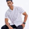 White striped casual Shirt in printed slab Cotton fabric. Designed with a Cuban collar and short sleeves.