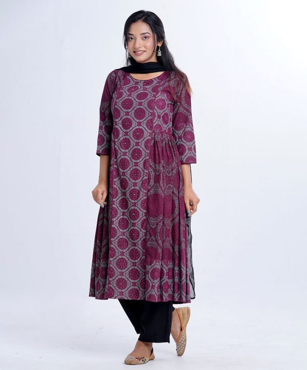 Plum all-over printed Salwar Kameez in Viscose fabric. The Kameez is designed with a round neck and three-quarter sleeves. Embellished with embroidery at the front and gathers from the waistline. Complemented by culottes pants and printed chiffon dupatta.