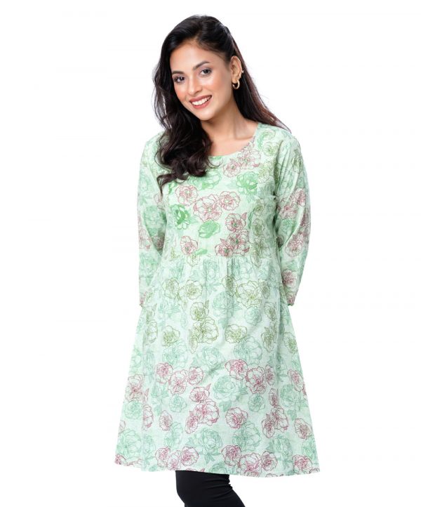 Green all-over printed A-line Tunic in Viscose fabric. Designed with a round neck and three-quarter sleeves. Embellished with embroidery at the front and cuffs. Gathers from the waistline. Single button opening at the back.