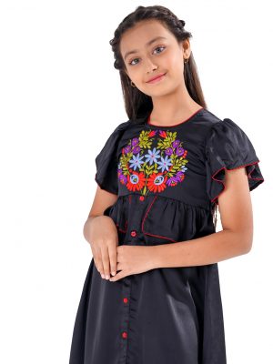 Black A-line Frock in Crepe fabric. Designed with a round neck and butterfly sleeves. Embellished with embroidery at the front. Detailed with extended ruffles around the waistline. Viscose lining in half-body. Zipper closure at the back.