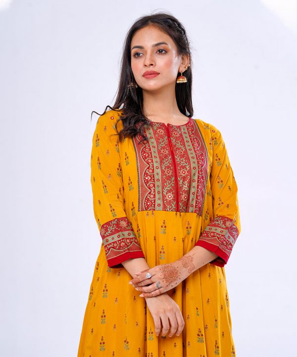 Mustard all-over printed pattern A-line Long Tunic in Viscose fabric. Features a band collar with hook closure at the front and three-quarter sleeves. Embellished with embroidery at the top front. Printed patch attachment at the cuffs.