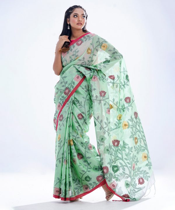 Mint green half-silk Saree with contrast paree. Embellished with all-over thread work.