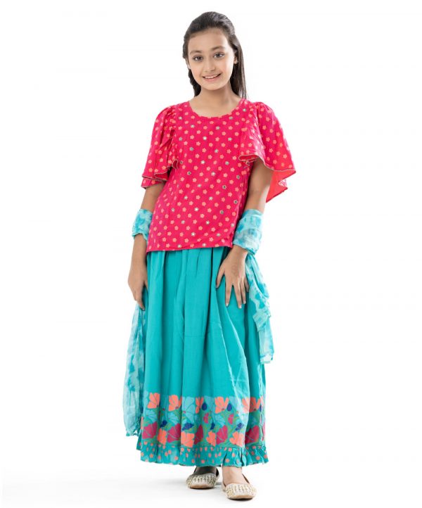 Magenta and Turquoise all-over printed Ghagra-choli set in Viscose fabric. The top is designed with a round neck and butterfly sleeves. Embellished embroidery at the top front. Button opening at the back. Paired with the gathered skirt with a concealed elasticated waistline. Spliced gather hemline. Complemented with tie-dye chiffon dupatta.