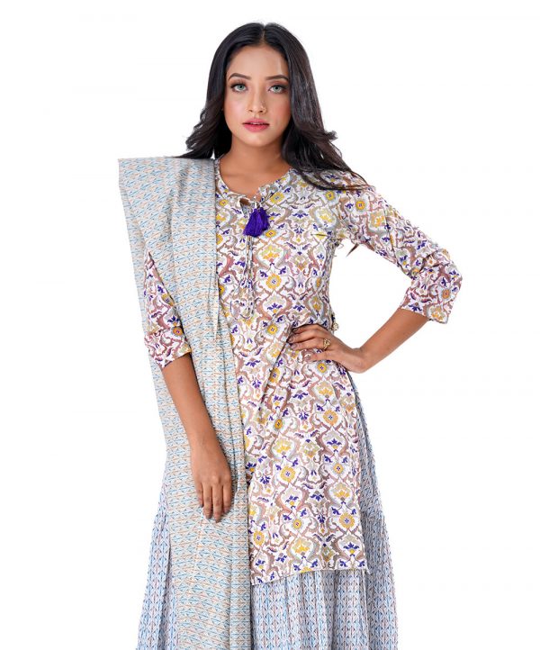 White all-over printed Salwar Kameez suit with a tiered-patterned long gown and printed Kameez as a layer. Designed with a tie-cord neckline and jeweled tassels on the slits. Complemented with printed half-silk dupatta and Pajamas.