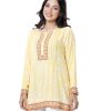 Yellow A-line Tunic in printed Cotton fabric. Features a band neck with hook closure at the front and long sleeves. Embellished with pin tucks at the top front.