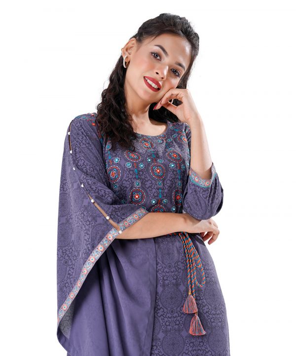 Gray all-over printed kaftan style Tunic in Georgette fabric. Designed with a round neck and three-quarter sleeves. Embellished with embroidery at the top front. Tasseled tie-cord closing at the front.