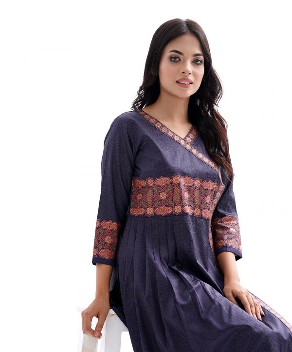 Navy blue all-over printed Kameez in Crepe fabric. Designed with a V-neck and three-quarter sleeves. Embellished with printed patches at the front and pleats from the waistline. Tasseled tie-cord closing at the one side.