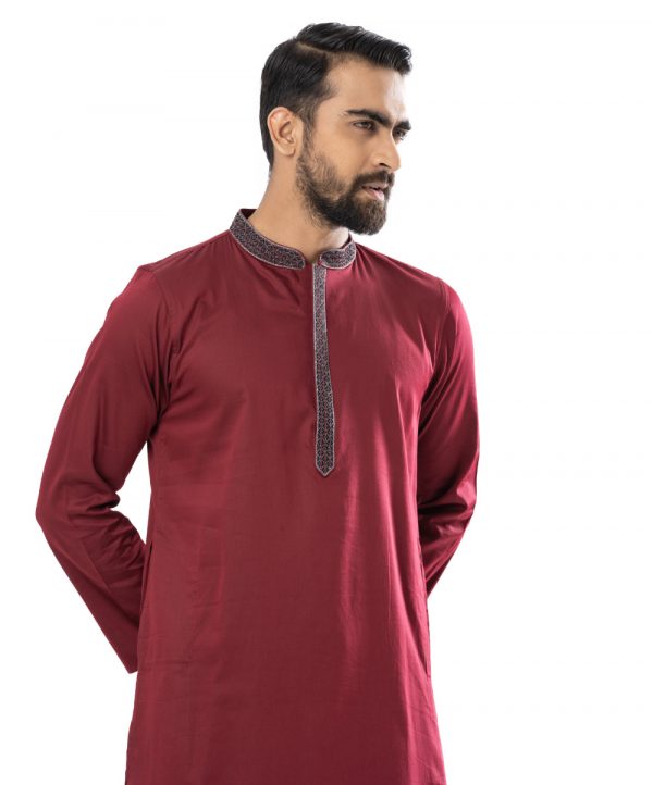 Maroon fitted Panjabi in Jacquard Cotton fabric. Designed with embroidery on the collar and hidden button placket.