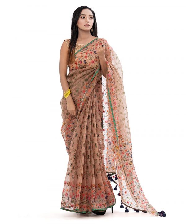 Rose Brown all-over printed exclusive Saree in Muslin fabric with a purple border. Embellished with karchupi, and decorative tassels on the achal.