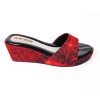 Red open-toe wedge heels with fabricated vamp.