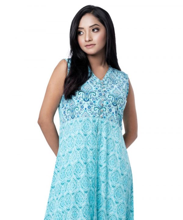 Blue all-over printed sleeveless long Shrug in georgette fabric. Embellished with beautiful buttons and elegant karchupi at the top front. Spliced gather hemline.