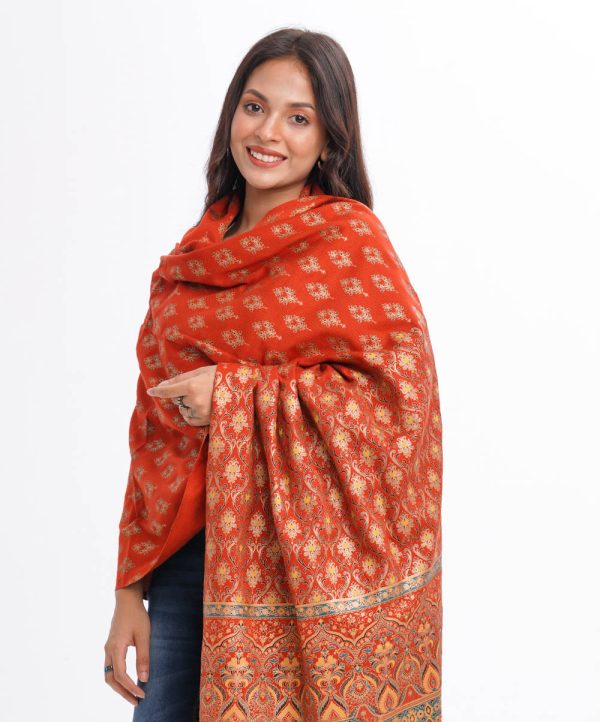 Brick orange all-over printed Shawl in Cotton viscose fabric. Features fringe trim on both sides.