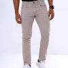 Men's slim fitted jeans in cotton spandex denim fabric. Five pockets, button fastening on the front and zipper fly.