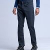 Men's slim fitted jeans in cotton spandex denim fabric. Five pockets, button fastening on the front and zipper fly.