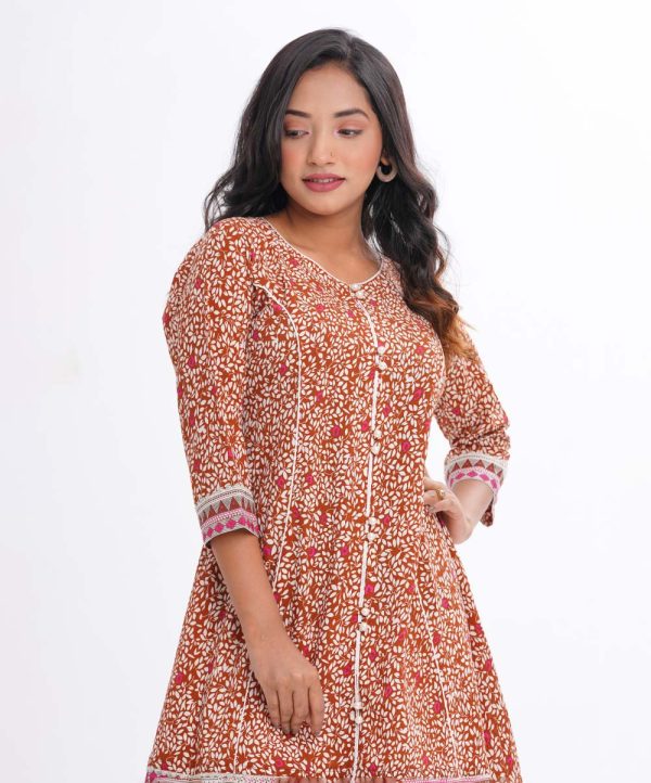 Brown A-line Tunic in printed Georgette fabric. Designed with a round neck and three-quarter sleeves. Detailed with princess cut at the front.