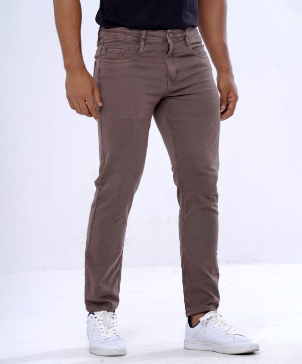 Men's slim fitted jeans in cotton spandex denim fabric. Five pockets, button fastening on the front and zipper fly.