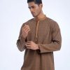 Brown semi-fitted panjabi in Jacquard Cotton fabric. Designed with a mandarin collar and hidden button placket.