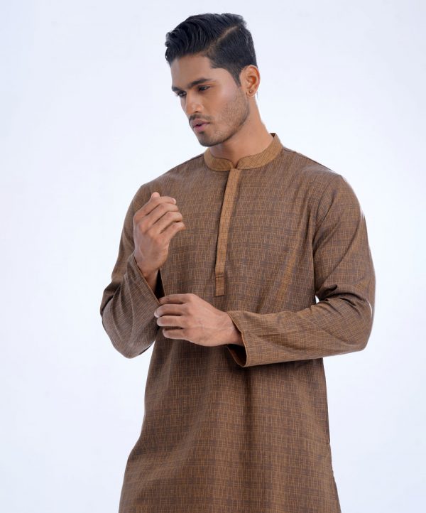 Brown semi-fitted panjabi in Jacquard Cotton fabric. Designed with a mandarin collar and hidden button placket.