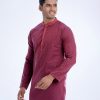 Red semi-fitted panjabi in Jacquard Cotton fabric. Designed with a mandarin collar and hidden button placket.