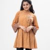 Brown all-over printed A-line Tunic in Georgette fabric. Features a band neck with hook closure at the front and wide sleeves. Embellished with embroidery at the top front.