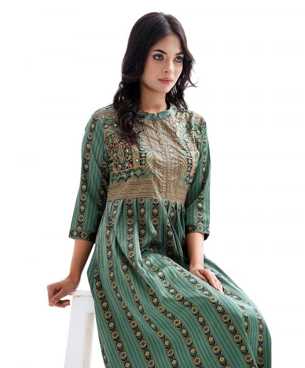 Green all-over printed A-line Tunic in Crepe fabric. Features a band neck with hook closure at the front, and three-quarter sleeves. Embellished with embroidery at the top front and pleats from the waistline. Unlined.