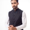 Black Waistcoat in Cotton fabric. Features a mandarin collar with front button fastening. Embellished with embroidery at the front. Taffeta lining in full body.