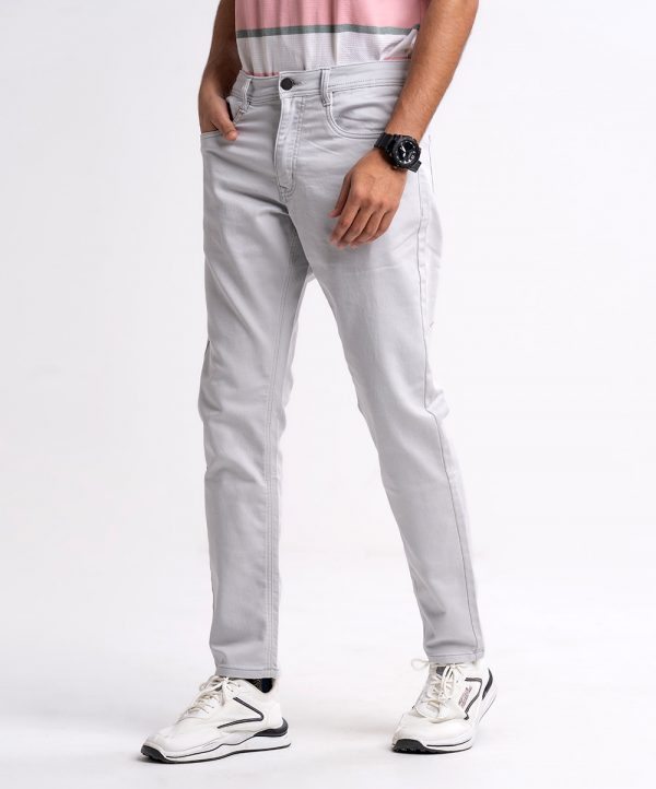 Gray slim fitted jeans in cotton spandex denim fabric. Five pockets, button fastening on the front and zipper fly.