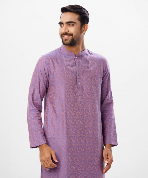 Purple fitted Panjabi in Jacquard Cotton fabric. Designed with a mandarin collar and matching metal buttons on the placket. Embellished with pin tucks at the top front.