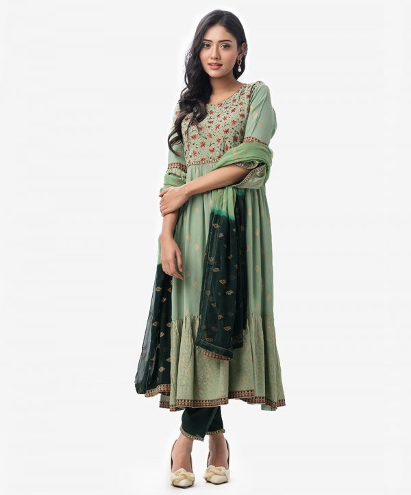 Silk & Viscose blended gown style Salwar Kameez. Bell sleeved, boat neckline and karchupi with beads. Printed chiffon dupatta with pant-style pajamas.