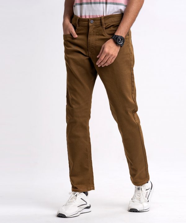 Men's slim fitted jeans in cotton spandex denim fabric. Five pockets, button fastening on the front and zipper fly.