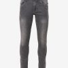 Men's slim fitted jeans in cotton spandex denim fabric. Five pockets, button fastening on the front and zipper fly.