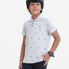 Kid boys short sleeves polo shirt in cotton pique fabric. Polka dot style tennis rackets printed.