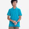 Teen boy short sleeves polo shirt in cotton pique fabric. Classic collar and print attributed.