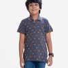 Kid boys short sleeves polo shirt in cotton pique fabric. Polka dot style turtle printed.