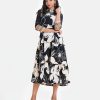 Women's flared style Maxi in printed Georgette fabric. Shirred collar, three-quarter sleeves with lace and patchwork. Tassel ties attach to the waistline.